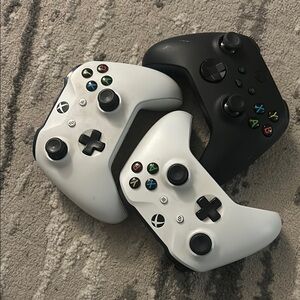 3 Xbox controllers working and in good condition, selling all three together.